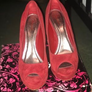 Red suede pumps
